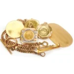 gold necklace and gold coin